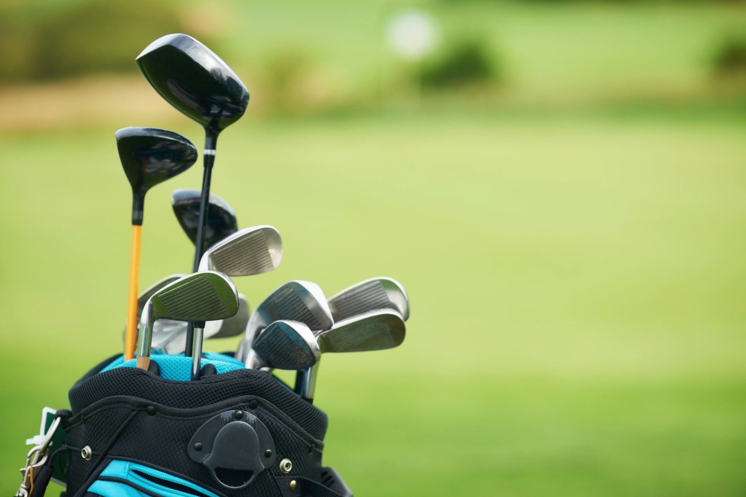 Golfer practicing on a course with focused technique
