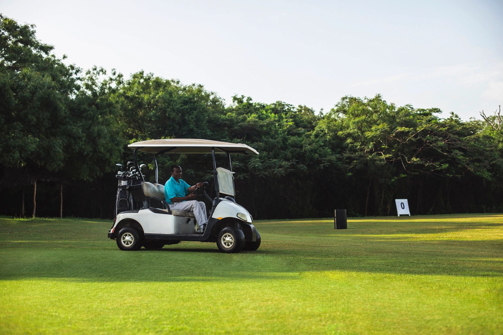 Golfer reviewing visual step-by-step instruction guide